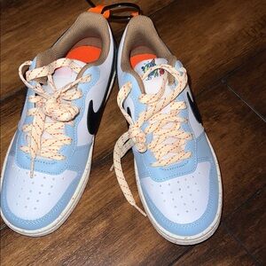 Nike Light Blue and White Sneakers with Orange Accents